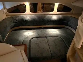 Slide: The Image of Interior of 1999 Cruisers Yachts 3375 Esprit with plush seating and ambient lighting. - 26