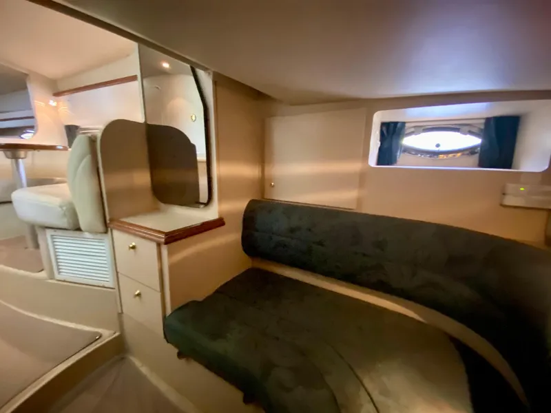 Slide: The Image of 1999 Cruisers Yachts 3375 Esprit interior with seating area and window view. - 28