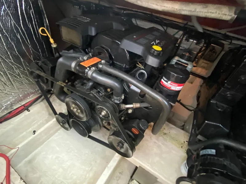 Slide: The Image of Engine compartment of a 1999 Cruisers Yachts 3375 Esprit, showcasing mechanical components. - 34