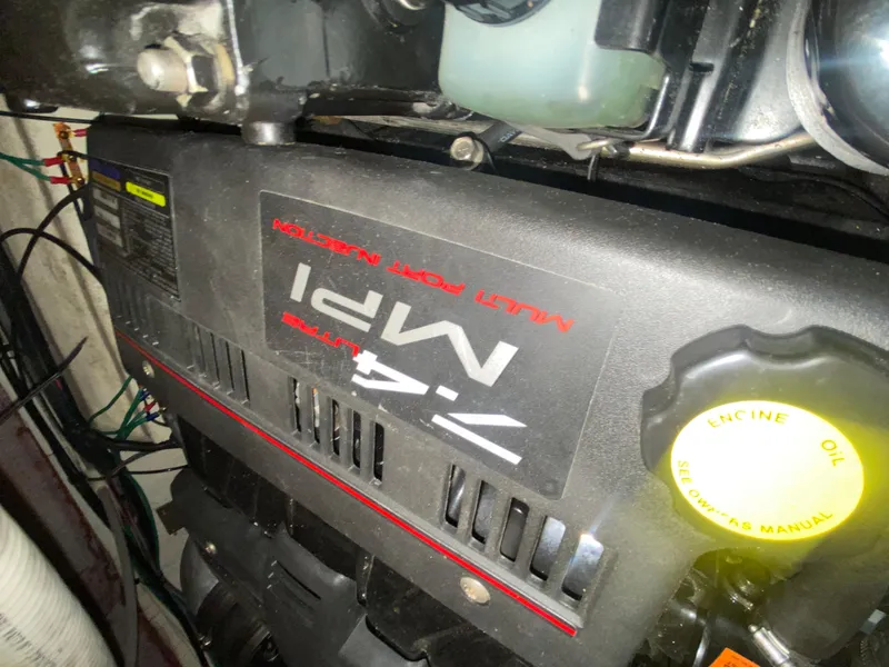 Slide: The Image of Engine compartment of a 1999 Cruisers Yachts 3375 Esprit, featuring a 7.4L MPI engine. - 36