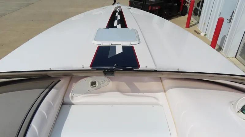 Slide: The Image of 2000 Donzi 28ZX boat deck with sleek design and checkered stripe detail. - 14