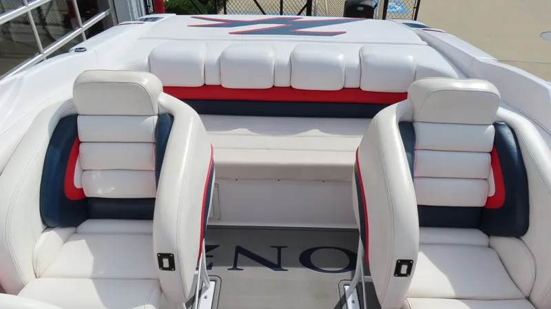 Slide: The Image of Interior of a 2000 Donzi 28ZX boat with white and red seating. - 16