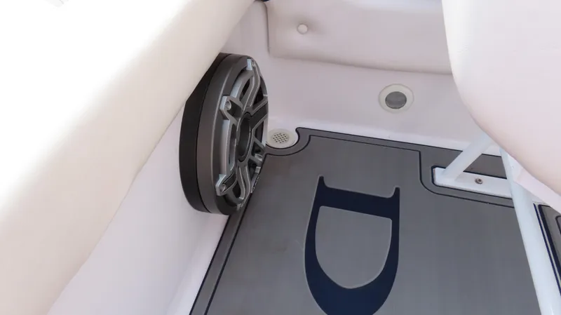 Slide: The Image of Interior of 2000 Donzi 28ZX boat showing speaker and custom flooring. - 20