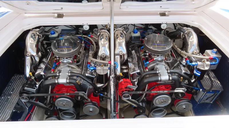 Slide: The Image of Twin engines in a 2000 Donzi 28ZX boat, showcasing polished components and intricate detailing. - 21