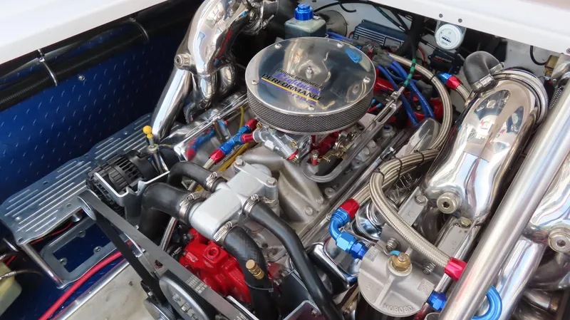 Slide: The Image of Engine of a 2000 Donzi 28ZX boat, featuring polished components and performance enhancements. - 22