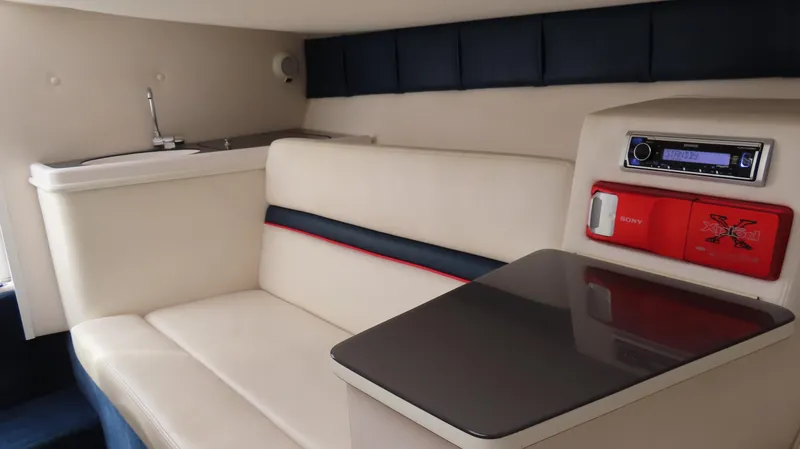 Slide: The Image of Interior of 2000 Donzi 28ZX boat with seating, table, and audio system. - 23