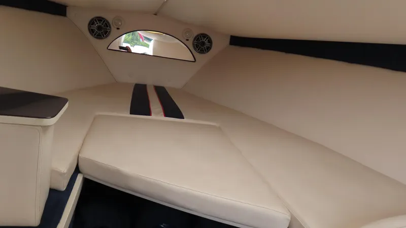 Slide: The Image of Interior cabin of a 2000 Donzi 28ZX boat with beige upholstery. - 25