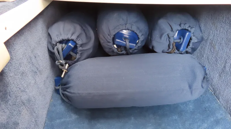 Slide: The Image of Blue fenders stored in a 2000 Donzi 28ZX boat compartment. - 26