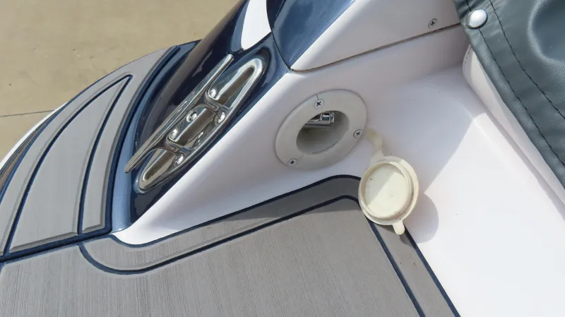 Slide: The Image of 2000 Donzi 28ZX boat deck detail with cleat and fuel cap. - 28