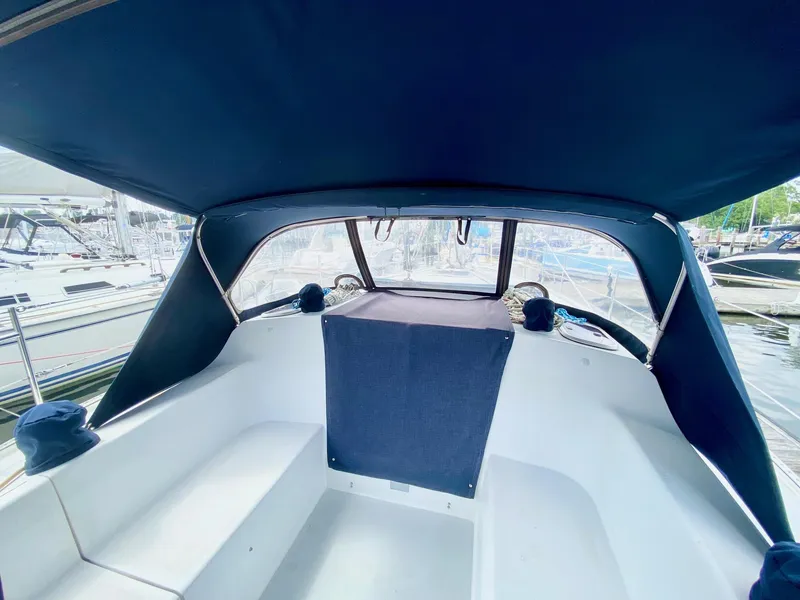 Slide: The Image of Interior view of a 1995 Catalina 36 MkII sailboat cockpit with blue canopy. - 12