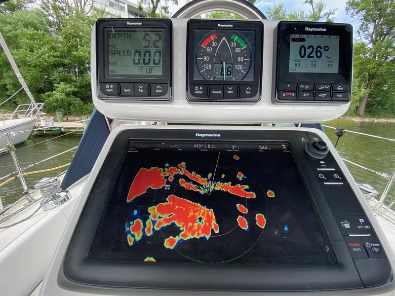 Slide: The Image of Sailing instruments on a 1995 Catalina 36 MkII, featuring Raymarine displays and radar. - 18