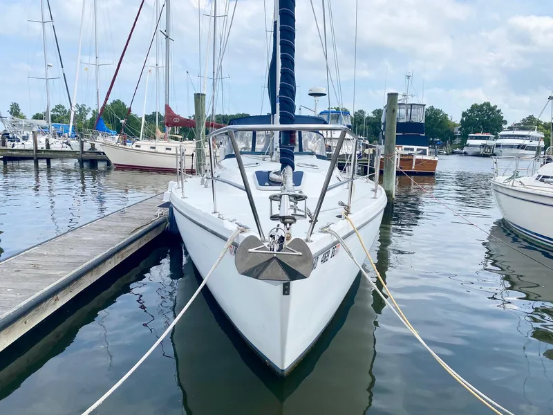 Slide: The Image of 1995 Catalina 36 MkII sailboat docked at marina, surrounded by other boats. - 2