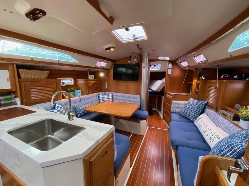 Slide: The Image of Interior of a 1995 Catalina 36 MkII sailboat with cozy seating and wooden finishes. - 20