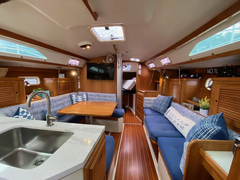 Slide: The Image of Interior of a 1995 Catalina 36 MkII sailboat with cozy seating and modern amenities. - 21