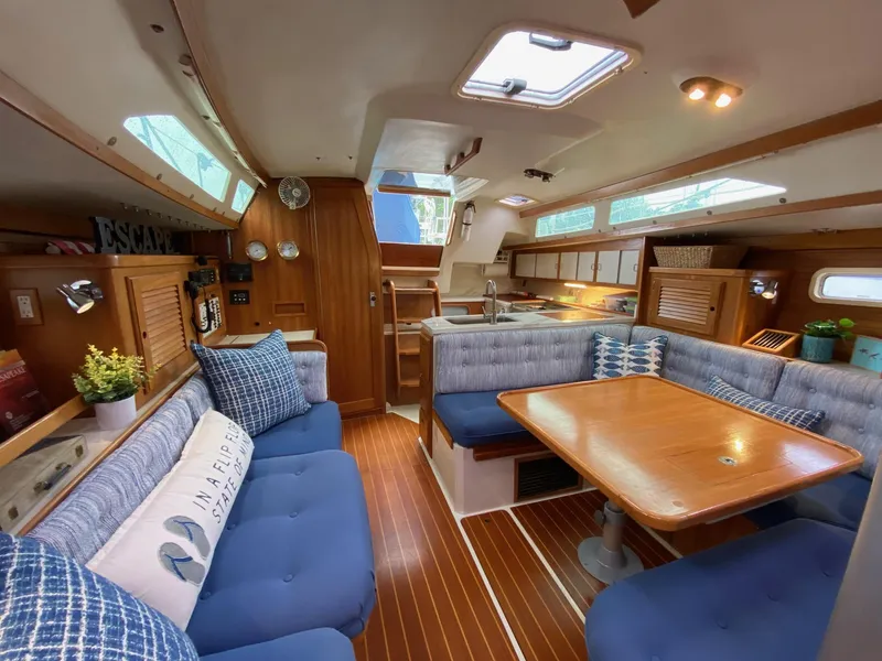 Slide: The Image of Interior of a 1995 Catalina 36 MkII sailboat with cozy seating and wooden finishes. - 22