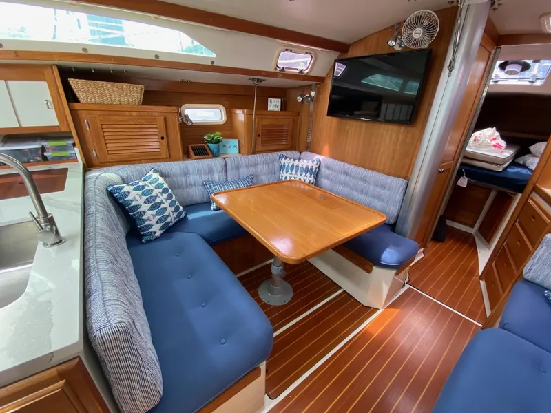 Slide: The Image of Interior of 1995 Catalina 36 MkII sailboat with cozy dining area and modern amenities. - 25