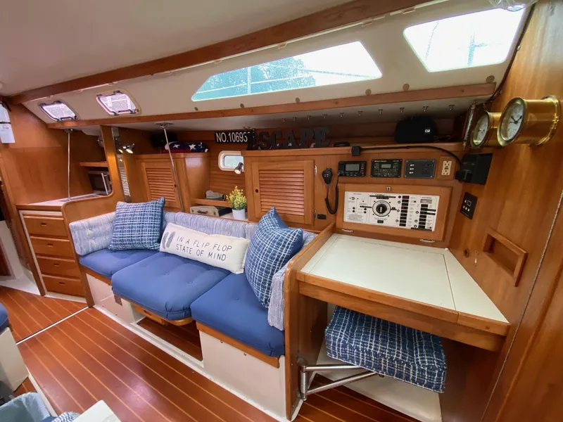 Slide: The Image of Interior of 1995 Catalina 36 MkII sailboat with cozy seating and navigation station. - 29