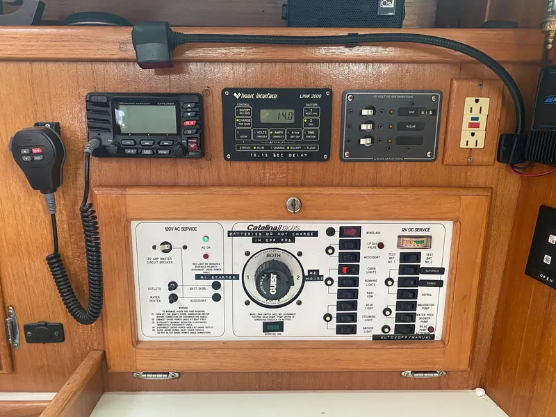 Slide: The Image of Control panel of a 1995 Catalina 36 MkII yacht with various switches and displays. - 30
