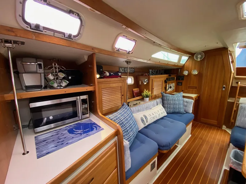 Slide: The Image of Interior of a 1995 Catalina 36 MkII sailboat with cozy seating and modern amenities. - 32