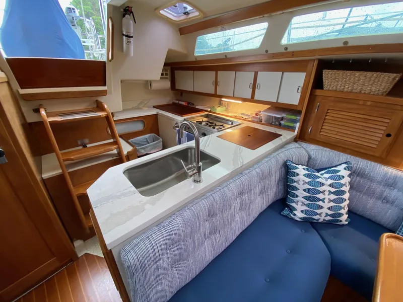 Slide: The Image of Interior of 1995 Catalina 36 MkII sailboat with kitchen and seating area. - 33