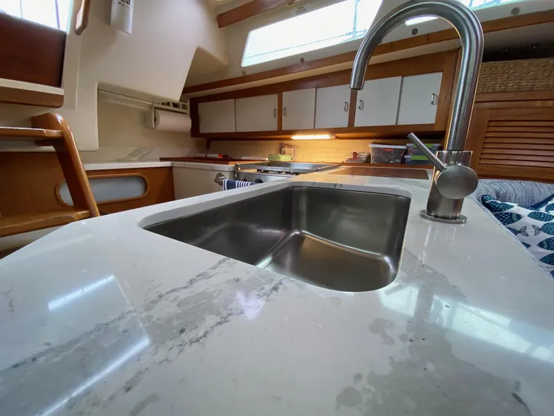 Slide: The Image of Interior of 1995 Catalina 36 MkII yacht showing modern kitchen sink and cabinetry. - 34