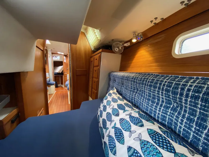 Slide: The Image of Interior of 1995 Catalina 36 MkII sailboat with cozy seating and nautical decor. - 45