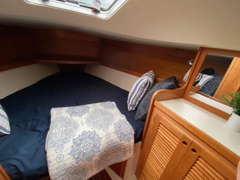 Slide: The Image of Cozy cabin interior of 1995 Catalina 36 MkII sailboat with bed and wooden cabinetry. - 48