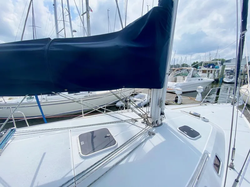 Slide: The Image of Sailboat deck of 1995 Catalina 36 MkII, docked at marina with covered mainsail. - 5