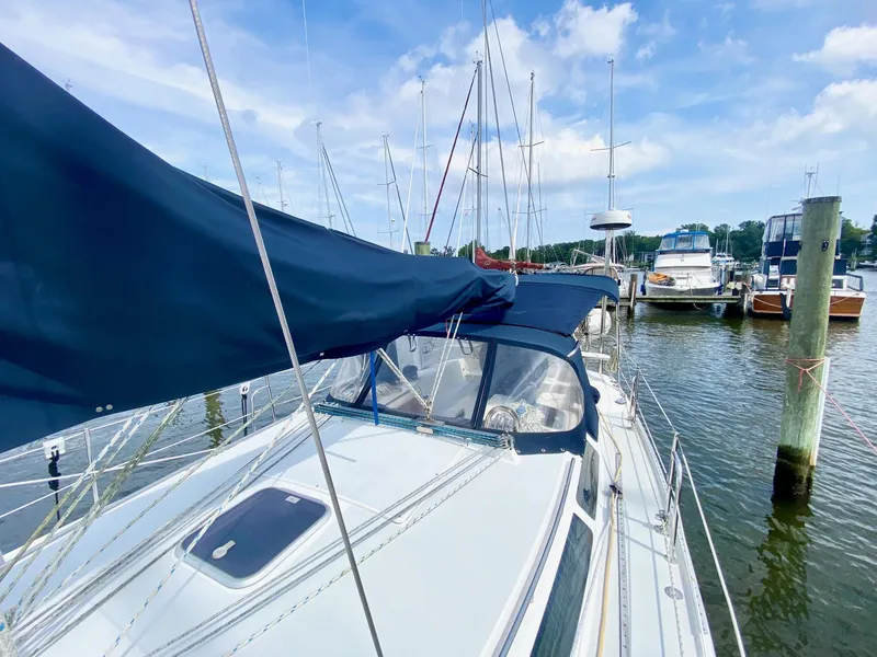 Slide: The Image of Sailboat Catalina 36 MkII 1995 docked at marina under blue sky. - 7