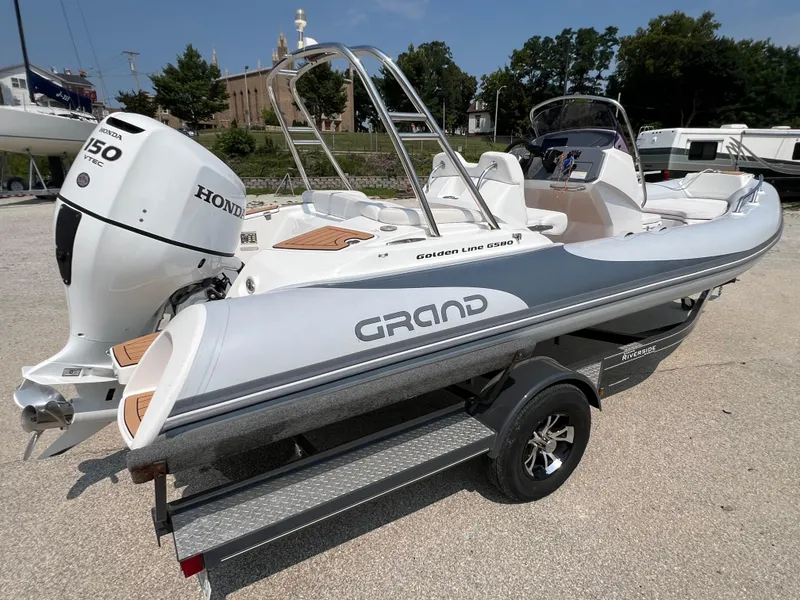 Slide: The Image of 2019 Grand G580HLF boat with Honda 150 VTEC engine on trailer. - 5