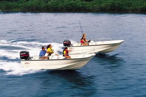 Slide: The Image of 2003 Boston Whaler 150 Sport boats speeding on water with passengers. - 4