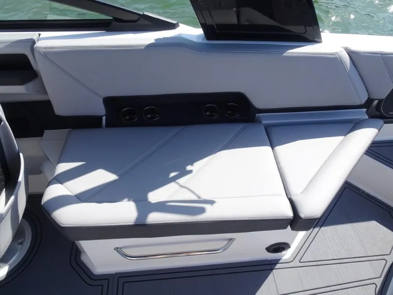 Slide: The Image of 2025 Cobalt R8 Surf boat interior with sleek seating and modern design. - 11