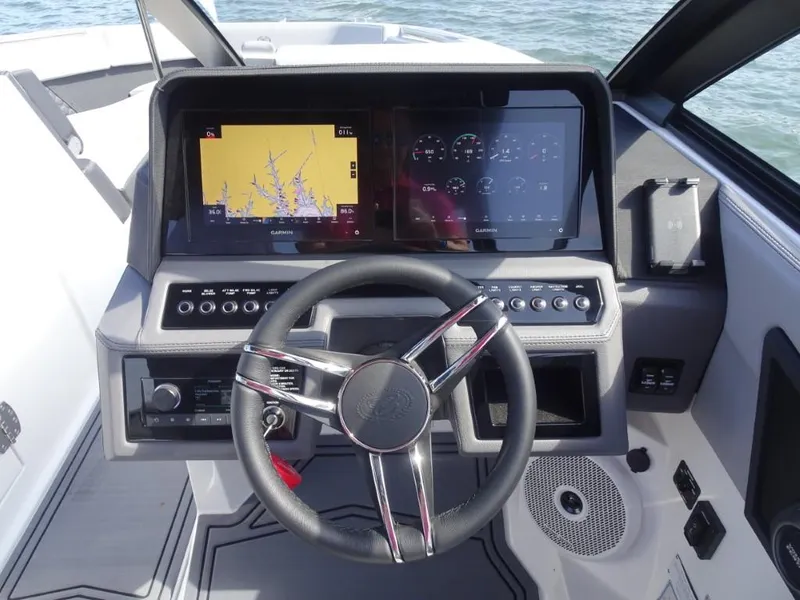 Slide: The Image of 2025 Cobalt R8 Surf boat dashboard with advanced navigation and control systems. - 13