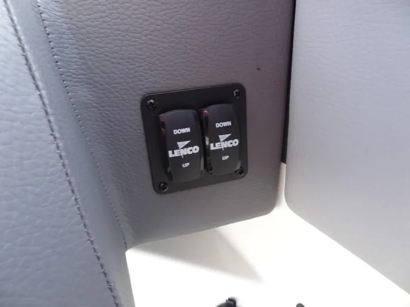 Slide: The Image of Lenco trim tab controls on 2025 Cobalt R8 Surf boat interior. - 16