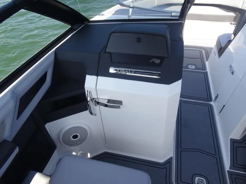 Slide: The Image of 2025 Cobalt R8 Surf boat interior with sleek design and modern features. - 18