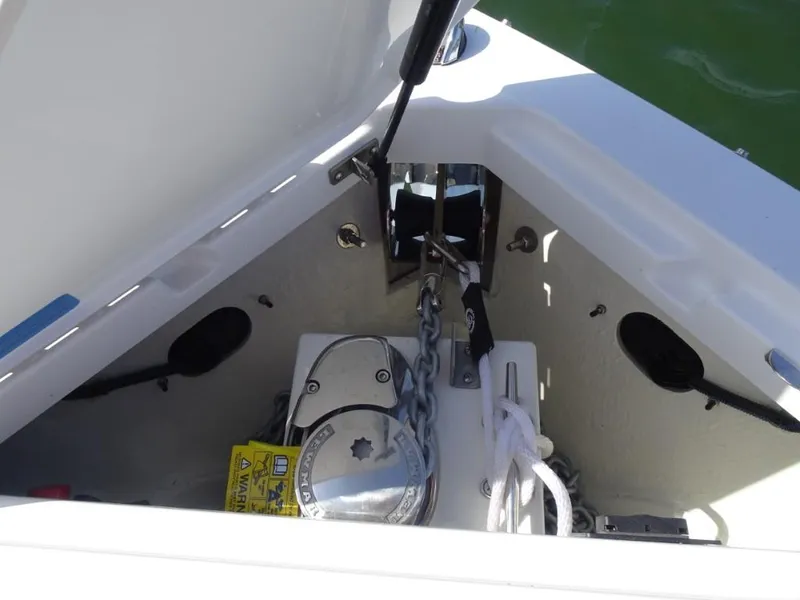 Slide: The Image of Anchor compartment of 2025 Cobalt R8 Surf boat with chain and rope. - 21