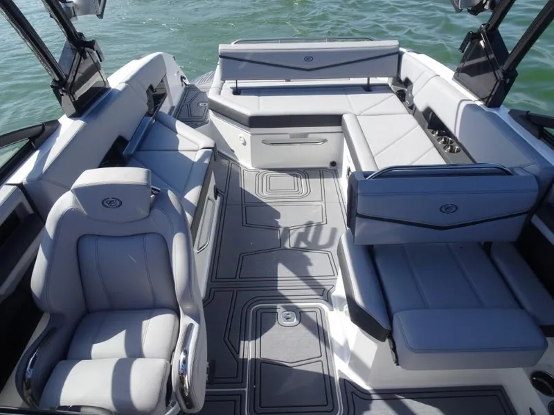 Slide: The Image of 2025 Cobalt R8 Surf boat interior with luxurious seating and modern design on the water. - 24
