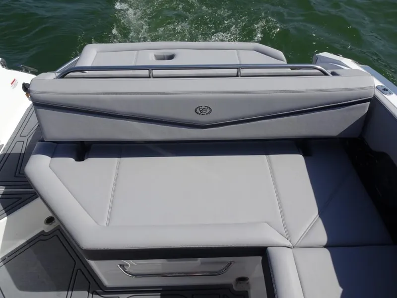 Slide: The Image of 2025 Cobalt R8 Surf boat with sleek gray seating on water. - 26