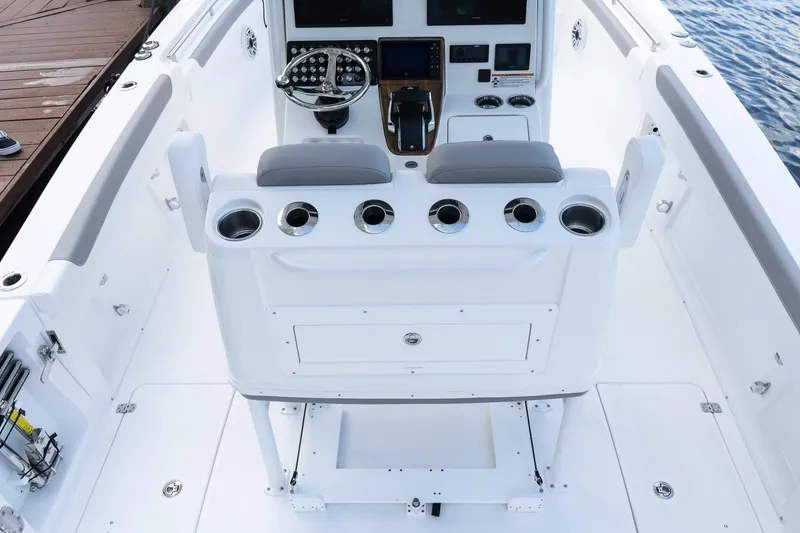 Slide: The Image of 2025 Caymas 291 HB boat cockpit with modern controls and seating. - 13