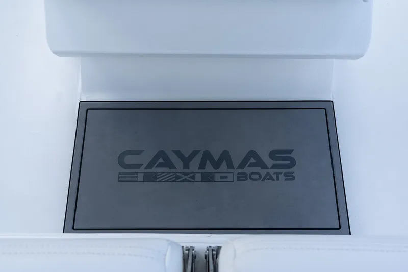 Slide: The Image of 2025 Caymas 291 HB boat logo on a sleek, modern deck surface. - 19