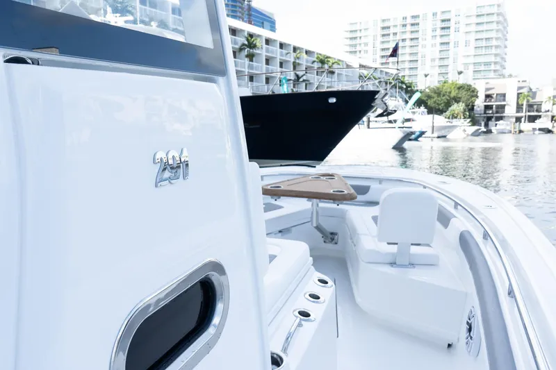 Slide: The Image of 2025 Caymas 291 HB boat with sleek design docked in marina. - 27