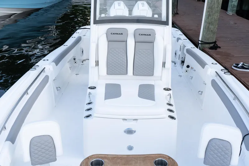 Slide: The Image of 2025 Caymas 291 HB boat interior with cushioned seating and sleek design. - 32