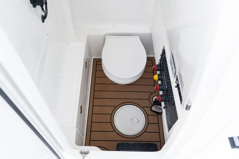Slide: The Image of 2025 Caymas 291 HB boat interior with toilet and control panel. - 35