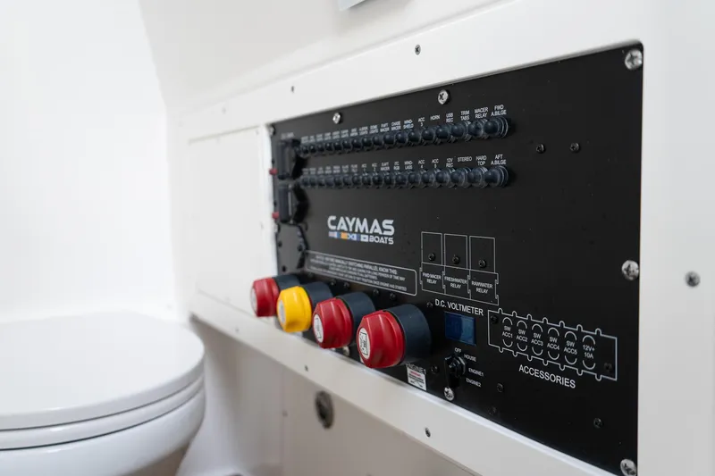 Slide: The Image of Control panel of 2025 Caymas 291 HB boat, featuring switches and voltmeter. - 36