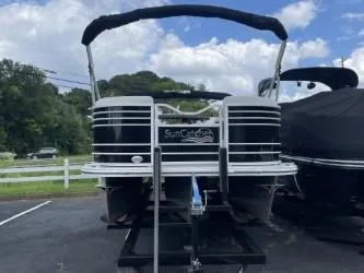 Slide: The Image of 2023 G3 SunCatcher Elite 324 SS pontoon boat on trailer, parked outdoors. - 10