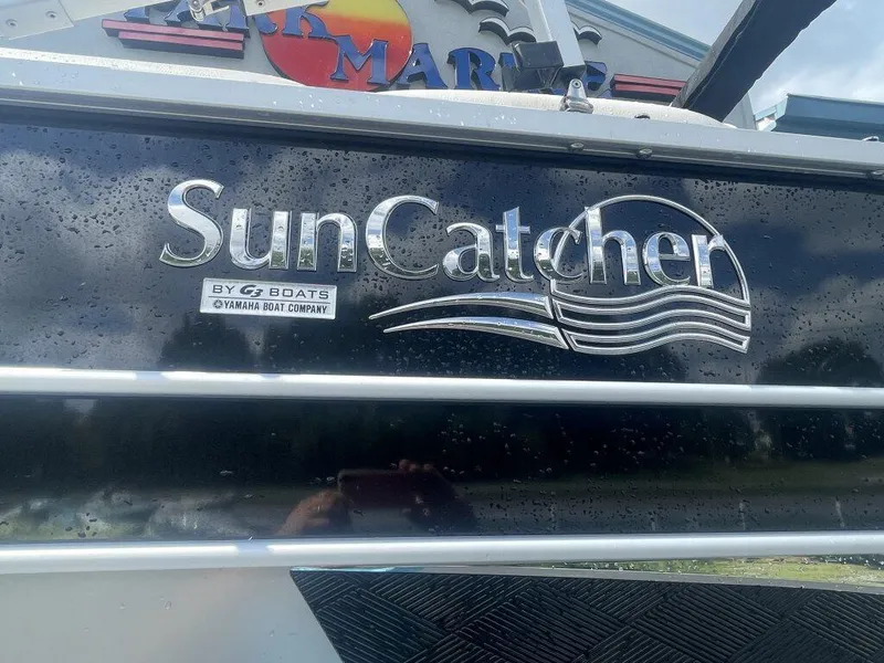 Slide: The Image of 2023 G3 SunCatcher Elite 324 SS boat logo with water droplets. - 3