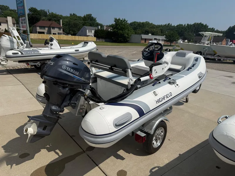 Slide: The Image of 2024 Highfield Classic 360 FCT boat with Yamaha outboard motor on a trailer. - 3