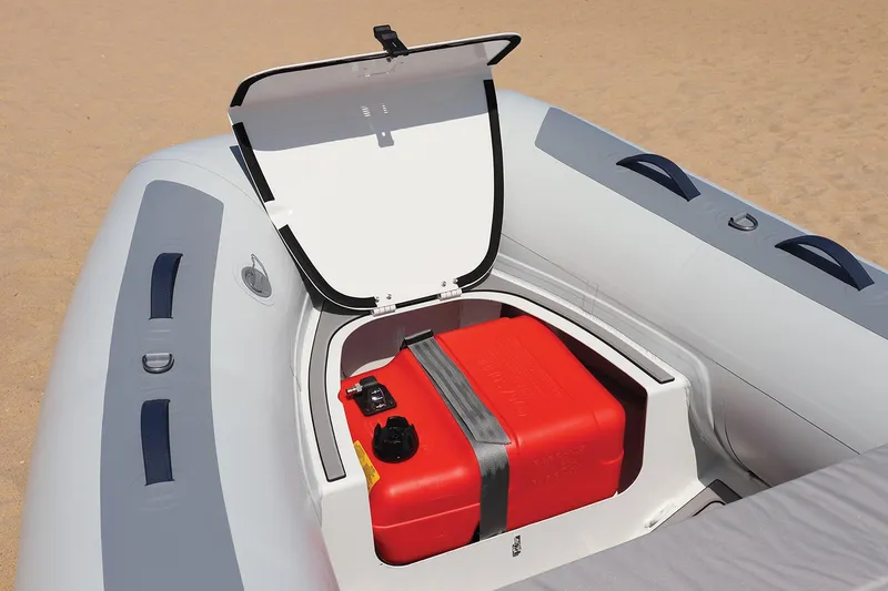 Slide: The Image of Manufacturer Provided Image: 2024 Highfield Classic 360 FCT inflatable boat with open storage compartment and red fuel tank. - 6