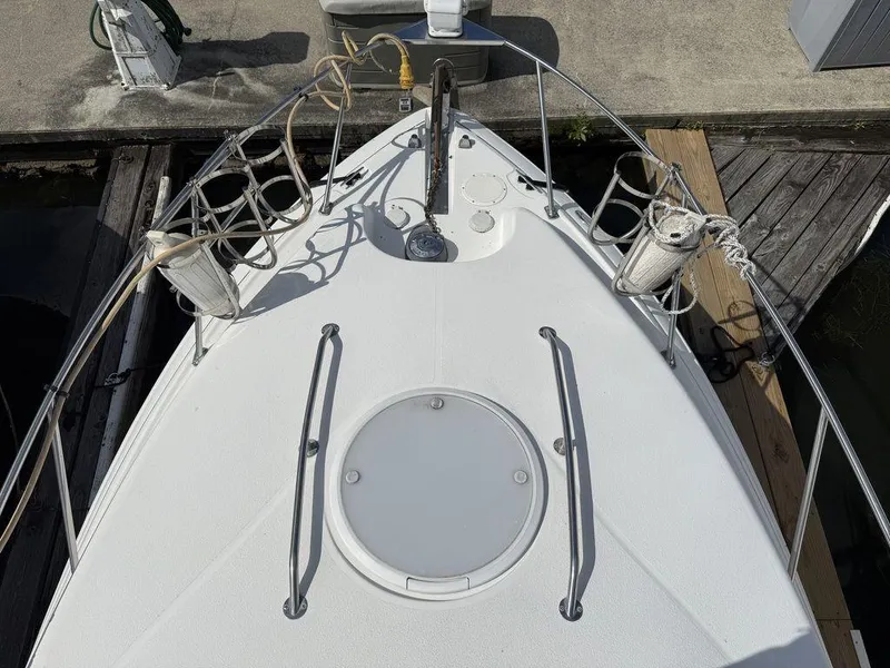 Slide: The Image of Bow of 2006 Larson 240 Cabrio boat docked at marina. - 10