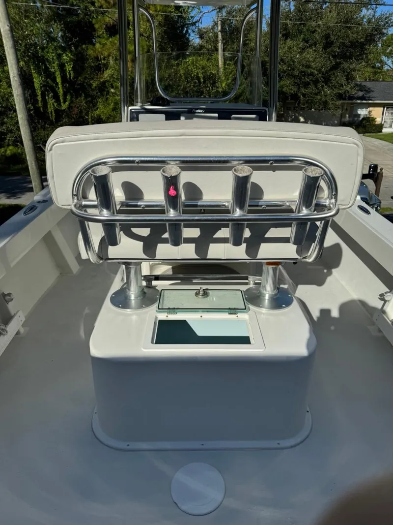 Slide: The Image of 2022 Parker 2300 Special Edition boat interior with rod holders and storage compartment. - 17